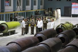 This undated photo released from North Korea's official Korean Central News Agency (KCNA) on August 14, 2023 shows North Korea's leader Kim Jong Un (C) inspecting an important munitions factory at an undisclosed location in North Korea. (Photo by KCNA VIA KNS / AFP) / SOUTH KOREA OUT / REPUBLIC OF KOREA OUT - EDITORS NOTE: BLURRING IS FROM SOURCE