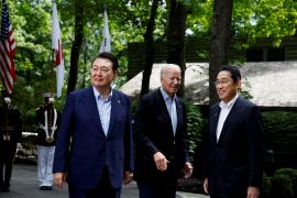 U.S. President Joe Biden greets Japanese Prime Minister Fumio Kishida and South Korean President Yoon Suk Yeol during the trilateral summit at Camp David near Thurmont, Maryland, U.S., August 18, 2023. REUTERS/Evelyn Hockstein