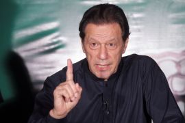 FILE PHOTO: Pakistan's former Prime Minister Imran Khan, gestures as he speaks to the members of the media at his residence in Lahore