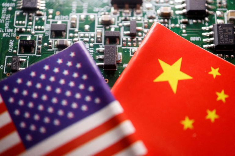 FILE PHOTO: Illustration picture of Chinese and U.S. flags with semiconductor chips