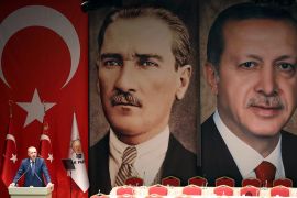 Turkish President Recep Tayyip Erdogan addresses a meeting of provincial election officials at the headquarters of his ruling Justice and Development (AK) Party in front of a giant portrait of him and one of Mustafa Kemal Ataturk, the founder of modern Turkey, in Ankara on January 29, 2019. (Photo by Adem ALTAN / AFP) (Photo by ADEM ALTAN/AFP via Getty Images)