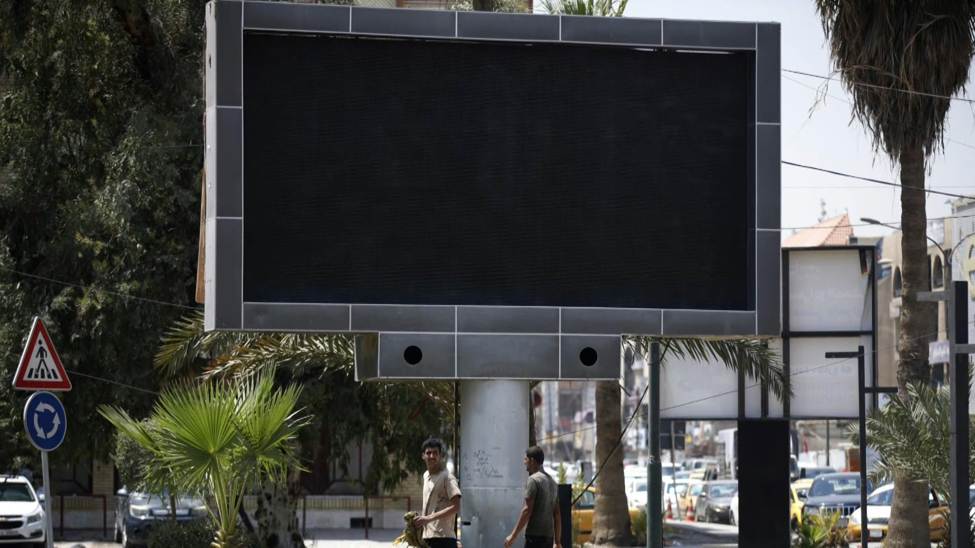 Instead of ads.. Propaganda screens in Baghdad and Babylon display obscenities and anger Iraqis |  projects