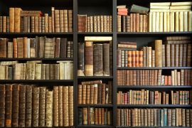 old books on wooden shelf; Shutterstock ID 1561137233; purchase_order: aljazeera ; job: ; client: ; other: