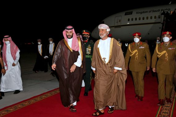 Saudi Crown Prince Mohammed bin Salman is welcomed by the Sultan of Oman, Haitham bin Tariq, upon his arrival at the airport in the Omani capital Muscat on December 6, 2021. (Photo by AFP)