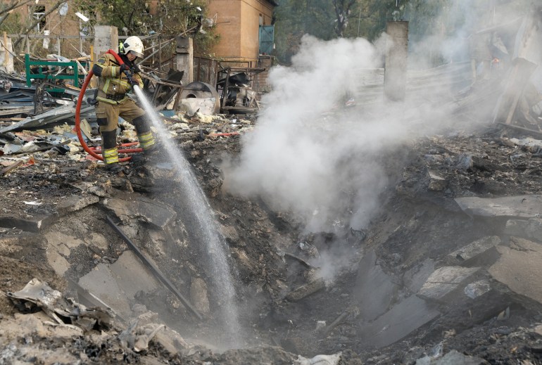 epa10873777 A Ukrainian rescuer works at the site where debris from a missile fell on a residential area in Kyiv (Kiev), Ukraine, 21 September 2023, amid the Russian invasion. Ukraine recorded 43 rocket attacks overnight, 36 of which were shot down, the Ukrainian Air Force said. As a result of falling debris, damage was reported in the capital Kyiv's districts of Darnytskyi, Solomyanskyi, Shevchenkivskyi, Ihor Klymenko, Ukraine's Minister of Internal Affairs wrote on telegram, adding that fires broke out in the Darnytskyi district injuring seven people, including a child. EPA-EFE/SERGEY DOLZHENKO