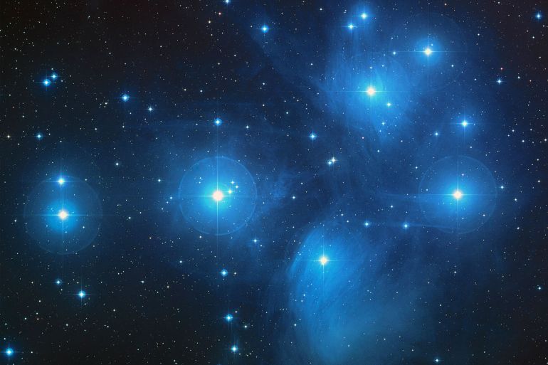 The Pleiades, an open cluster consisting of approximately 3,000 stars at a distance of 400 light-years (120 parsecs) from Earth in the constellation of Taurus. It is also known as ‘The Seven Sisters’, or the astronomical designations NGC 1432/35 and M45. المصدر : ناسا