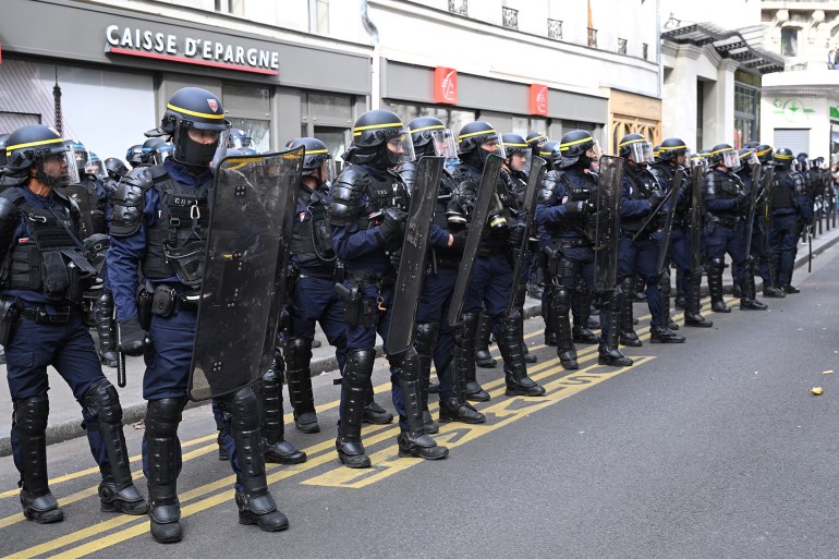 French anti-riot police officers stand guard during a "united march" against police brutality called by NGOs, unions and parties, in Paris on September 23, 2023. - Around 30,000 people are expected in several French cities on September 23, 2023 for demonstrations "against systemic racism, police violence and for public freedoms", called by the far left and various organisations, under heavy police surveillance. (Photo by Bertrand GUAY / AFP)
