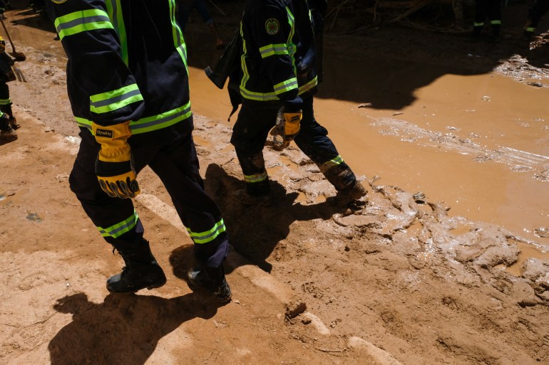 Members of the rescue teams from the Egyptian army walk on the mud, after a powerful storm and heavy rainfall hit Libya, in Derna, Libya September 13, 2023. REUTERS/Esam Omran Al-Fetori