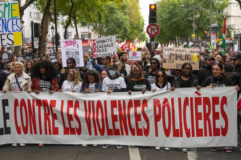 1 of 9 | People march with a banner that reads, "against police violences," in Paris, Saturday, Sept. 23, 2023. Activists from community groups, far-left parties and unions have held marches around France against racism and police brutality. (AP Photo/Michel Euler)