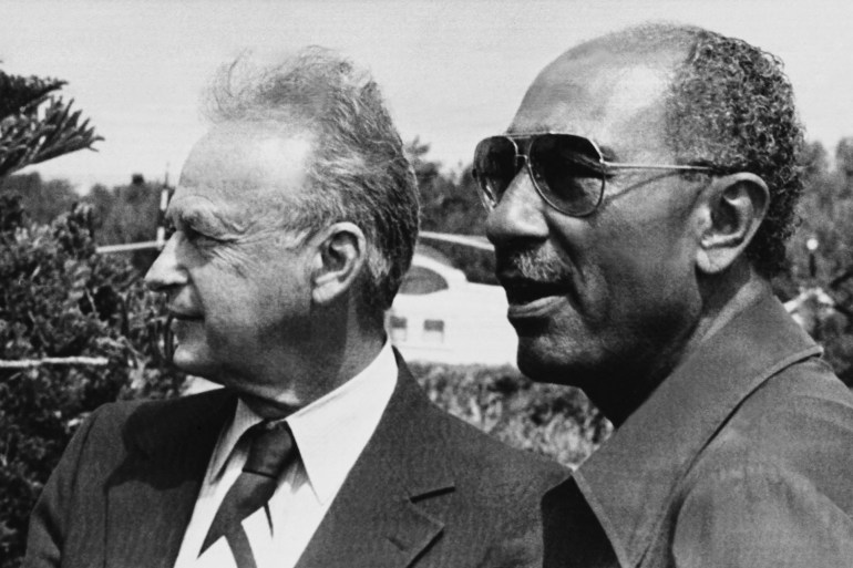 photo taken on September 9, 1980 in Alexandria shows Israeli Prime Minister Yitzhak Rabin (L) and President of Egypt Anouar el Sadate (R). The agreement of Egypt–Israel Peace Treaty signed on March 26, 1979 notably made Egypt the first Arab state to officially recognize Israel. AFP PHOTO (Photo by STRINGER / AFP)