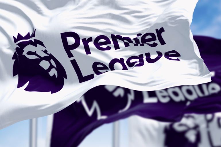London, UK, april 2023: Three Premier League flags waving in the wind. Premier League is the top level of the English football league system. Illustrative editorial 3d illustration render; Shutterstock ID 2326492565; purchase_order: aljazeera ; job: ; client: ; other: