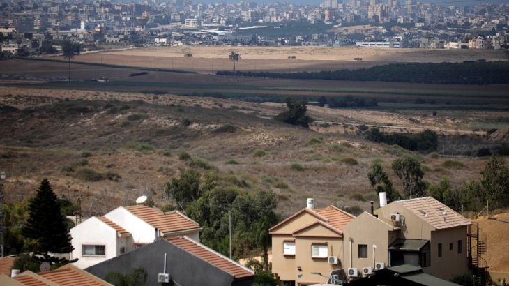Buildings in the Gaza Strip are seen in the background as houses in the Israeli city of Sderot are seen in the foreground, southern Israel September 24, 2020. Picture taken September 24, 2020. REUTERS/Amir Cohen