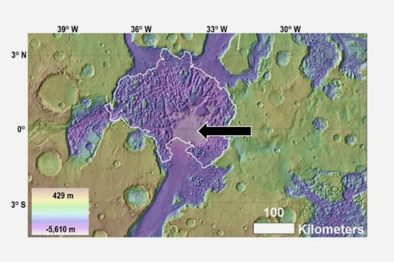 Above, view of Hydraotes Chaos (white outline), including the location of the proposed mud lake (black arrow). Credit: NASA.