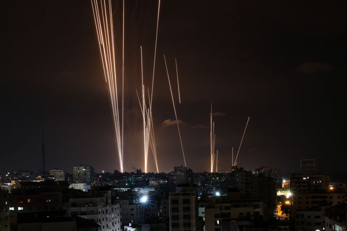 EDITORS NOTE: Graphic content / A salvo of rockets is fired by Palestinian militants from Gaza City toward Israel on October 7, 2023. - At least 70 people were reported killed in Israel, while Gaza authorities released a death toll of 198 in the bloodiest escalation in the wider conflict since May 2021, with hundreds more wounded on both sides. (Photo by MAHMUD HAMS / AFP)