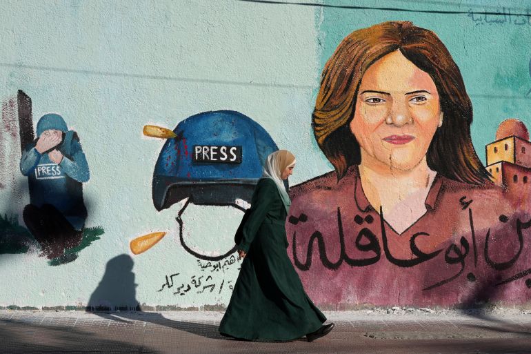A mural of slain of Al Jazeera journalist Shireen Abu Akleh adorns a wall, in Gaza City, Sunday, May 15, 2022. Abu Akleh was shot and killed while covering an Israeli raid in the occupied West Bank town of Jenin on May 11, 2022. (AP Photo/Adel Hana)