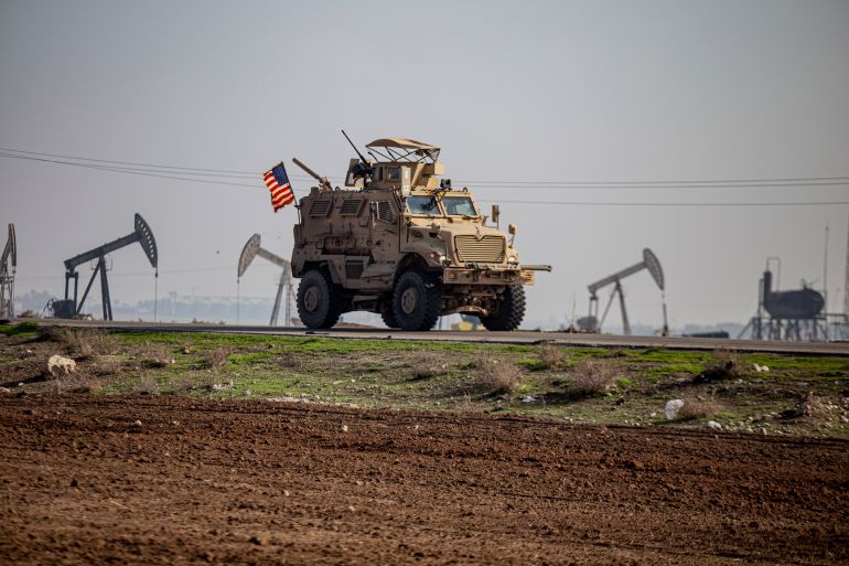 FILE - A US military vehicle on a patrol in the countryside near the town of Qamishli, Syria, on Dec. 4, 2022. Syria's U.S.-backed and Kurdish-led forces on Tuesday, Sept. 5, 2023 pushed deeper into the last stronghold of Arab tribesmen who have taken up arms against them in eastern Syria as a spokesperson said they hoped to end the dayslong clashes there in the “next 24 hours.” (AP Photo/Baderkhan Ahmad, File)