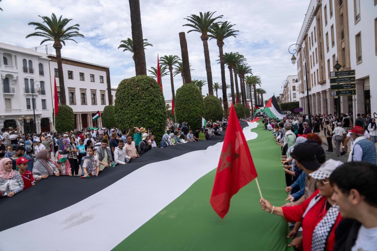 Thousands of Moroccans take part in a protest in solidarity with Palestinians in Gaza, in Rabat, Morocco, Sunday, Oct. 15, 2023. (AP Photo/Mosa'ab Elshamy)