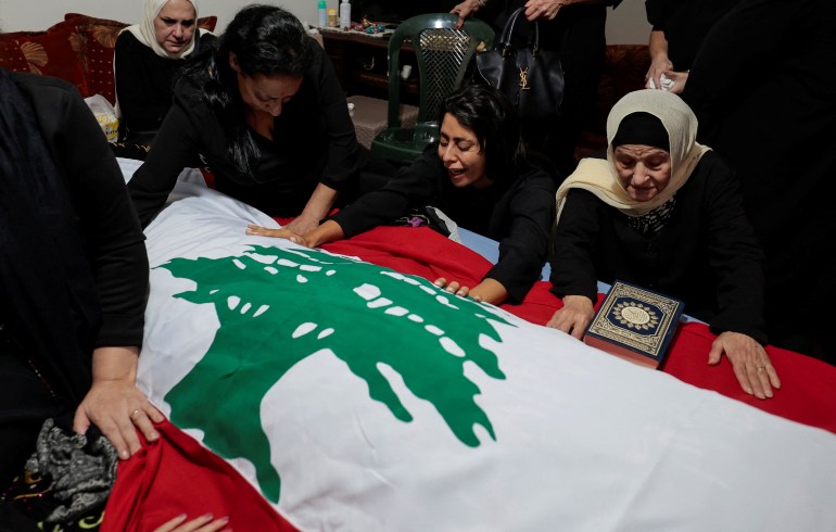 Miryam Fayad, mourns her cousin Issam Abdallah, a Lebanese national and Reuters videojournalist who was killed in southern Lebanon by shelling from the direction of Israel, during his funeral in his home town of Al Khiyam, Lebanon October 14, 2023. REUTERS/Zohra Bensemra