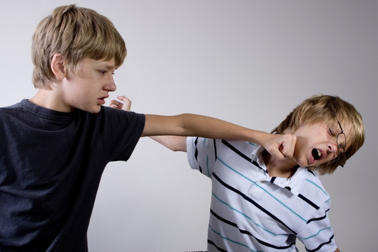 Two boys fighting.