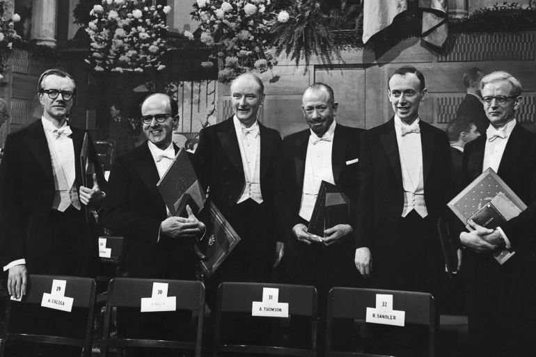 (Original Caption) NOBEL AWARDS DISTRIBUTIONS 1962....The traditional Nobel festivities are taking place today, December 10th, 1962 in Stockholm under the observance of the traditional ceremonies. In the Stockholm Concert Hall in the central city, the awards were distributed this afternoon at 4:30 p.m. Our picture shows the award winners, left to right: Professor Maurice Wilkins, Dr. Max Perutz, Prof. Francis Crick, John Steinbeck, Dr. James Watson, and Dr. John Kendrew posing with their awards after the distribution when they received them.