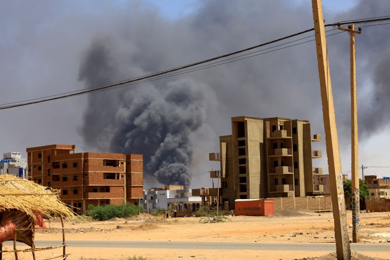 FILE PHOTO: Smoke rises above buildings after an aerial bombardment during clashes between the paramilitary Rapid Support Forces and the army, in Khartoum North, Sudan, May 1, 2023. REUTERS/Mohamed Nureldin Abdallah/File Photo