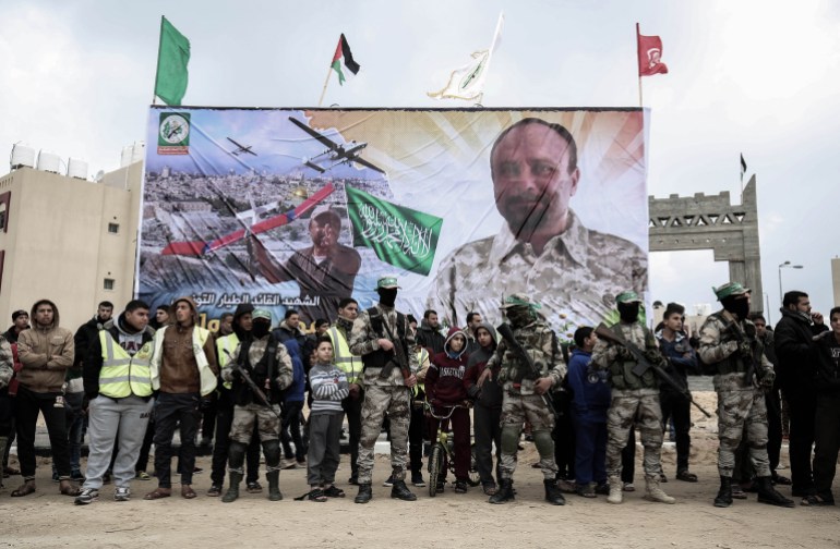 Members of the Ezzedine al-Qassam Brigades, the military wing of the Palestinian Islamist movement Hamas, attend a memorial in the southern Gaza Strip town of Rafah on January 31, 2017, for Mohamed Zouari, a 49-year-old Tunisian engineer and drone expert, who was murdered at the wheel of his car outside his house in Tunisia in December 2016. The armed wing of Hamas said that the Jewish state was responsible for the murder in eastern Tunisia, of Mohamed Zaouari, described as a leader of the Islamist movement specializing in the development of drones. (Photo by SAID KHATIB / AFP)