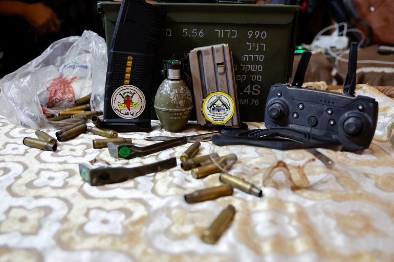 Military items which Palestinian gunmen say were seized from Israeli forces in a gunfight are displayed, in Tulkarm, in the Israeli-occupied West Bank, October 5, 2023. REUTERS/Raneen Sawafta