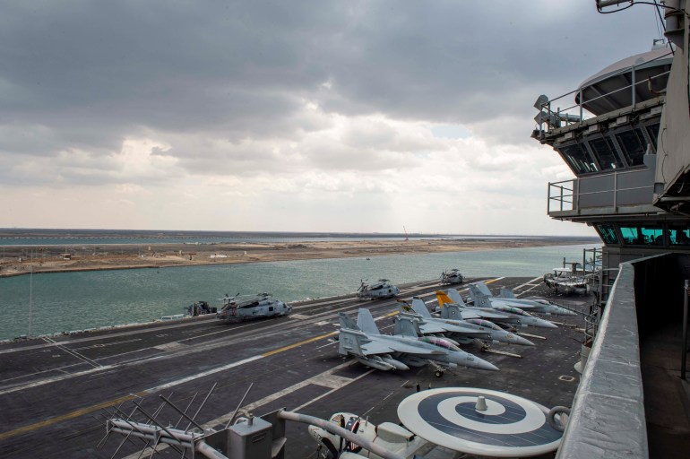 United States Navy aircraft carrier USS Dwight D. Eisenhower (CVN 69) transits the Suez Canal, in this picture taken April 2, 2021 and released by U.S. Navy on April 3, 2021. Cameron Pinske/U.S. Navy/Handout via REUTERS ATTENTION EDITORS- THIS IMAGE HAS BEEN SUPPLIED BY A THIRD PARTY.