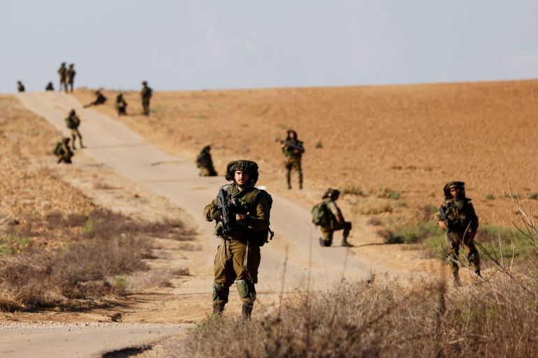 Israeli soldiers patrol an area near Israel's border with the Gaza Strip, in southern Israel October 19, 2023. REUTERS/Amir Cohen