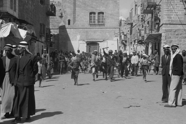Arab youths running in Bethlehem after burning government offices during Arab Revolt. Sept. 14, 1938