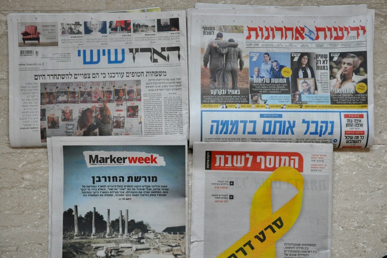 ***INSIDE*** Photo 1 The weekend truce made headlines in Israeli newspapers.