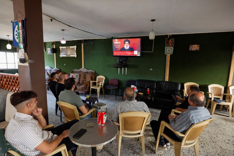 Palestinians watch the speech of Lebanon's Hezbollah leader Sayyed Hassan Nasrallah, in Hebron in the Israeli-Occupied West Bank, November 3, 2023. REUTERS/Mussa Qawasma