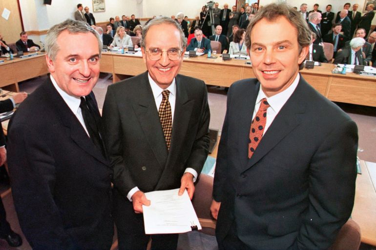 FILE - From right, British Prime Minister Tony Blair, U.S. Sen. George Mitchell, and Irish Prime Minister Bertie Ahern, pose together after they signed the Good Friday Agreement for peace in Northern Ireland, on April 10, 1998. It has been 25 years since the striking of the Good Friday Agreement, the landmark peace accord that ended three decades of violence in Northern Ireland, a period known as “the Troubles.” (AP Photo, File)