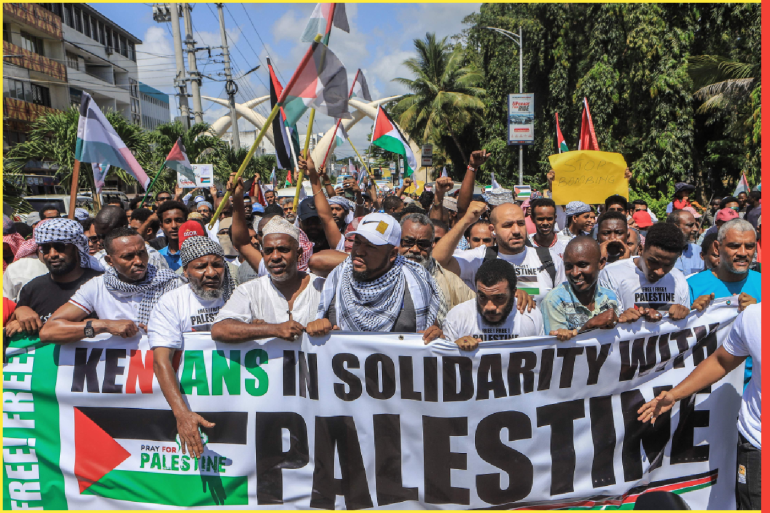 Members of the muslim community in Kenya hold banners as they wave Palestinian flags and chant slogans during a demonstration in solidarity with Palestine in Mombasa on October 21, 2023. Thousands of people, both Israeli and Palestinians have died since October 7, 2023, after Palestinian Hamas militants based in the Gaza Strip, entered southern Israel in a surprise attack leading Israel to declare war on Hamas in Gaza the following day. (Photo by STRINGER / AFP)