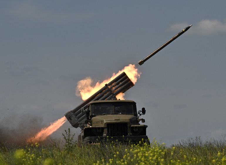 Ukrainian servicemen of the 57th Brigade fires BM-21 'Grad' multiple rocket launcher towards Russian positions at a front line near Bakhmut in the Donetsk region on June 20, 2023, amid the Russian invasion of Ukraine. (Photo by Genya SAVILOV / AFP)