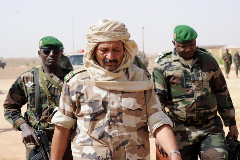 Malian colonel El Hadj Ag Gamou arrives at Gao airport to receive Niger army chief of staff Garba Seini on February 2, 2013 to visit Niger forces. French President Francois Hollande received a rapturous welcome as he visited Mali to push for African troops to take over a French-led offensive that drove back Islamist rebels from the country's desert north. AFP PHOTO / SIA KAMBOU (Photo by SIA KAMBOU / AFP)