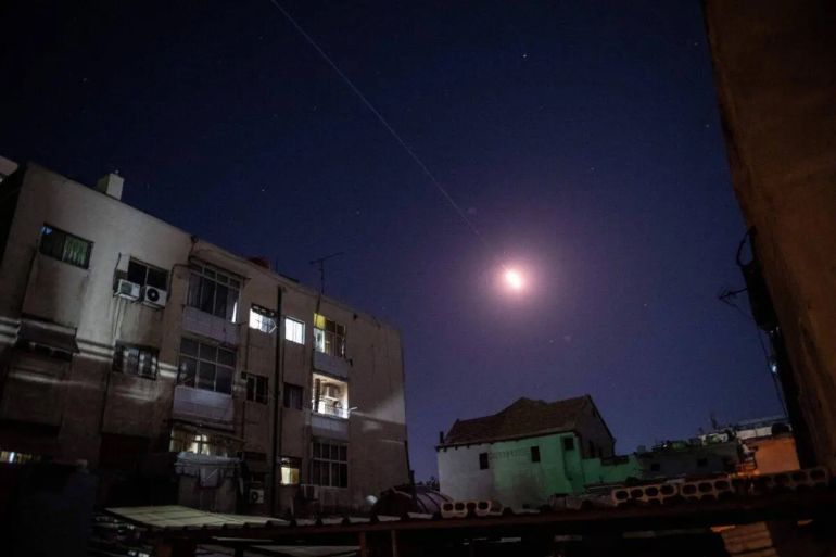 Flares of syrian air defense rockets are seen in the sky of Damascus on April 4, 2023 [STRINGER/AFP via Getty Images]
