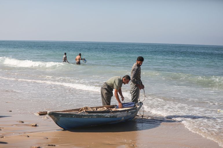 Daily life during humanitarian pause in Gaza- - DEIR AL-BALAH, GAZA - NOVEMBER 30: Palestinian fishers are on their boats to catch fish at a beach during the humanitarian pause in Deir al-Balah, Gaza on November 30, 2023.