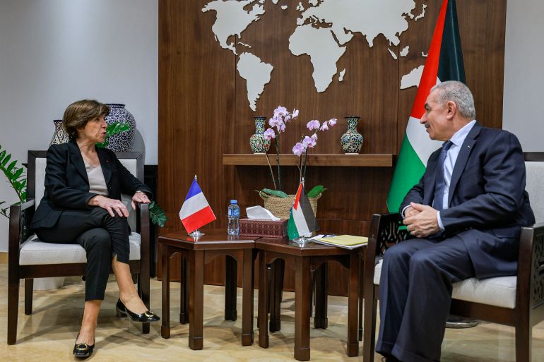Palestinian Prime minister Mohammad Shtayyeh (R) meets with the visiting French Foreign minister Catherine Colonna (L) at his headquarters in Ramallah in the occupied West Bank on December 17, 2023, amid the ongoing conflict in Gaza between Israel and the militant group Hamas. (Photo by Jaafar ASHTIYEH / AFP)
