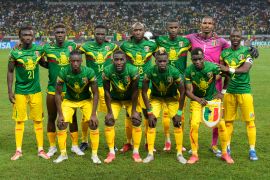 Mali's players pose for photographers before the start of their African Cup of Nations 2022 group F soccer match against Mauritania at the Japoma Stadium in Douala, Cameroon, Thursday, Jan. 20, 2022. (AP Photo/Themba Hadebe)