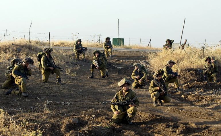 Israeli soldiers from the Golani Brigade take part in a military exercise in the Israeli-annexed Golan Heights near the border with Syria on June 26, 2013. The Golan Heights was seized by Israel from Syria in the 1967 Six Day War. AFP PHOTO/JACK GUEZ (Photo by JACK GUEZ / AFP)