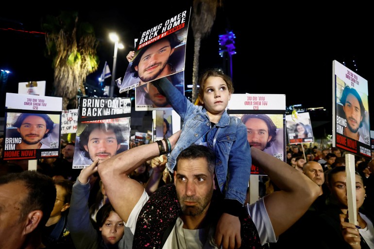 People rally calling for the release of hostages kidnapped on the deadly October 7 attack by Palestinian Islamist group Hamas, amid the ongoing conflict between Israel and the Palestinian Islamist group Hamas, in Tel Aviv, Israel, December 9, 2023. REUTERS/Clodagh Kilcoyne