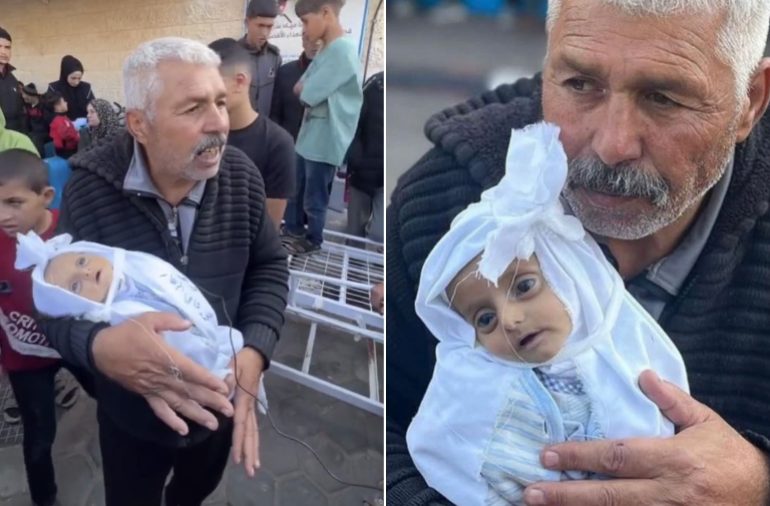 أب فلسطيني يحمل جثمان ابنه الرضيع بعد اسشتهاده في قصف إسرائيلي، بينما زعمت صحيفة جورزيلم بوست العبرية أن ما يظهر في الصورة مجرد دمية أطفال