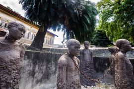 STONE TOWN, ZANZIBAR - AUGUST 24,2013: Historical Memorial with sculptures and chains near the former african slave trade place in slave market near to Anglican Cathedral.