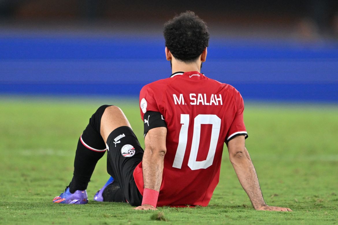 Egypt's forward #10 Mohamed Salah reacts after being injured during the Africa Cup of Nations (CAN) 2024 group B football match between Egypt and Ghana at the Felix Houphouet-Boigny Stadium in Abidjan on January 18, 2024. (Photo by Issouf SANOGO / AFP)