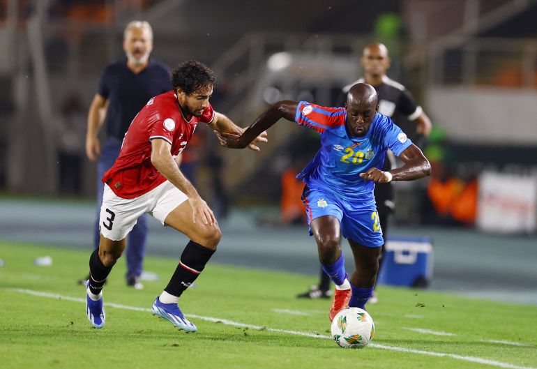 Soccer Football - Africa Cup of Nations - Round of 16 - Egypt v DR Congo - Laurent Pokou Stadium, San Pedro, Ivory Coast - January 28, 2024 Egypt's Mohamed Hany in action with DR Congo's Yoane Wissa REUTERS/Siphiwe Sibeko