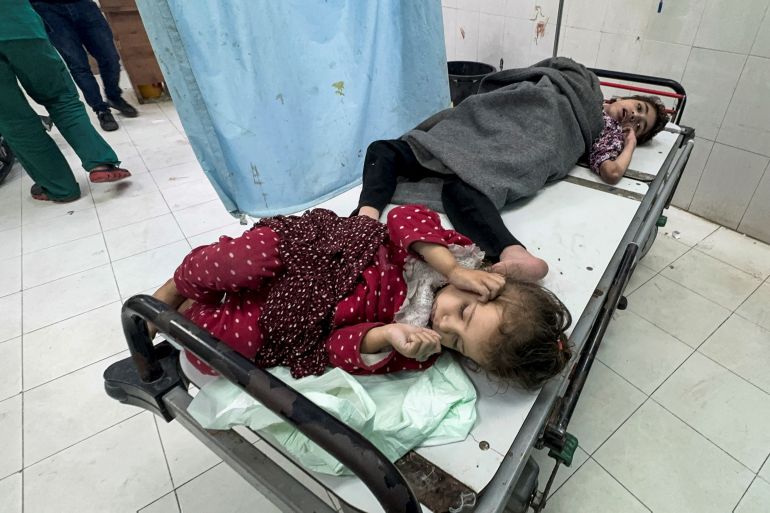 Palestinian children wounded in Israeli strikes lie on a hospital bed at Nasser hospital, amid the ongoing conflict between Israel and Palestinian Islamist group Hamas, in Khan Younis, in the southern Gaza Strip December 15, 2023. REUTERS/Bassam Masoud