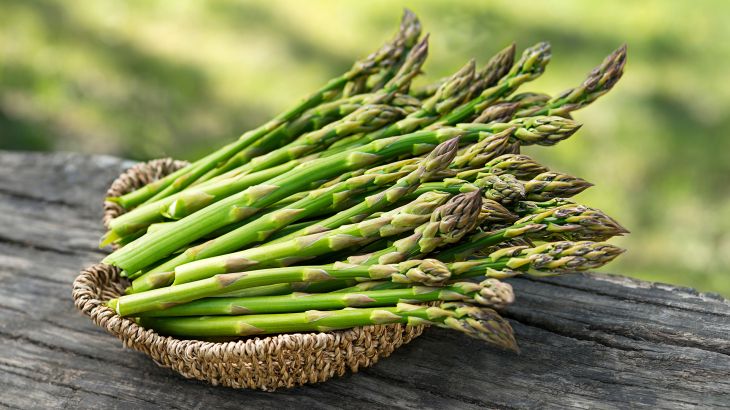 Asparagus. Fresh Asparagus. Pickled Green Asparagus. Bunches of green asparagus in basket, top view- Image; Shutterstock ID 1673452201; purchase_order: aljazeera ; job: ; client: ; other:
