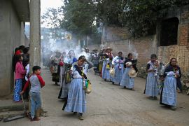 Purepecha’s Indigenous people carry incense as they walk during a 3-day ceremonial procession from Cocucho to Ocumicho indigenous villages in Michoacan State, Mexico, on January 31, 2024. - Every year, Purepecha’s Indigenous people from different regions of Michoacan State celebrate the Fuego Nuevo Purepecha (Purepecha’s New Fire), a fire lighting ceremony to mark the start of the new year. (Photo by CARL DE SOUZA / AFP)