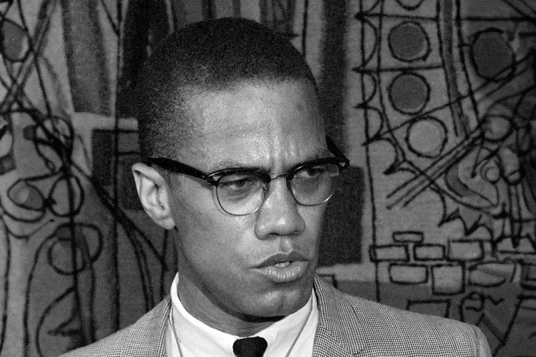FILE - This March 12, 1964 file photo, Malcolm X addresses reporters at the Hotel Park-Sheraton in New York. Malcolm X’s family and estate said rapper-singer Nicki Minaj’s use of the black nationalist with a rifle in his hands, juxtaposed with a racial slur, for her single artwork is disrespectful and offensive. In an exclusive statement to The Associated Press on Friday, Feb. 14, 2014, Malcolm X’s daughter, Ilyasah Shabazz, said Minaj’s use of the picture is “in no way is endorsed by my family.” (AP Photo, File)